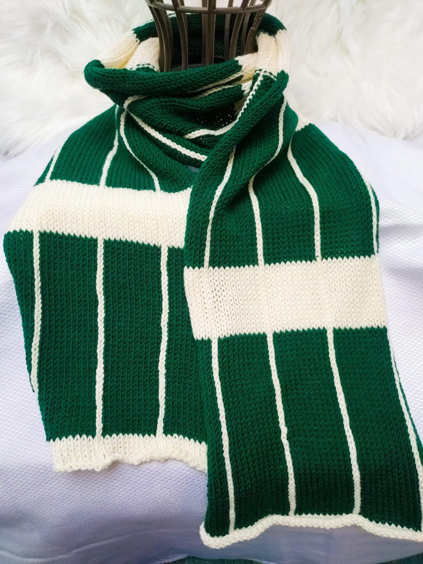 Flatlay photo of a Large Checkered Merino wool  soft sustainable scarf in colours bottle green & cream