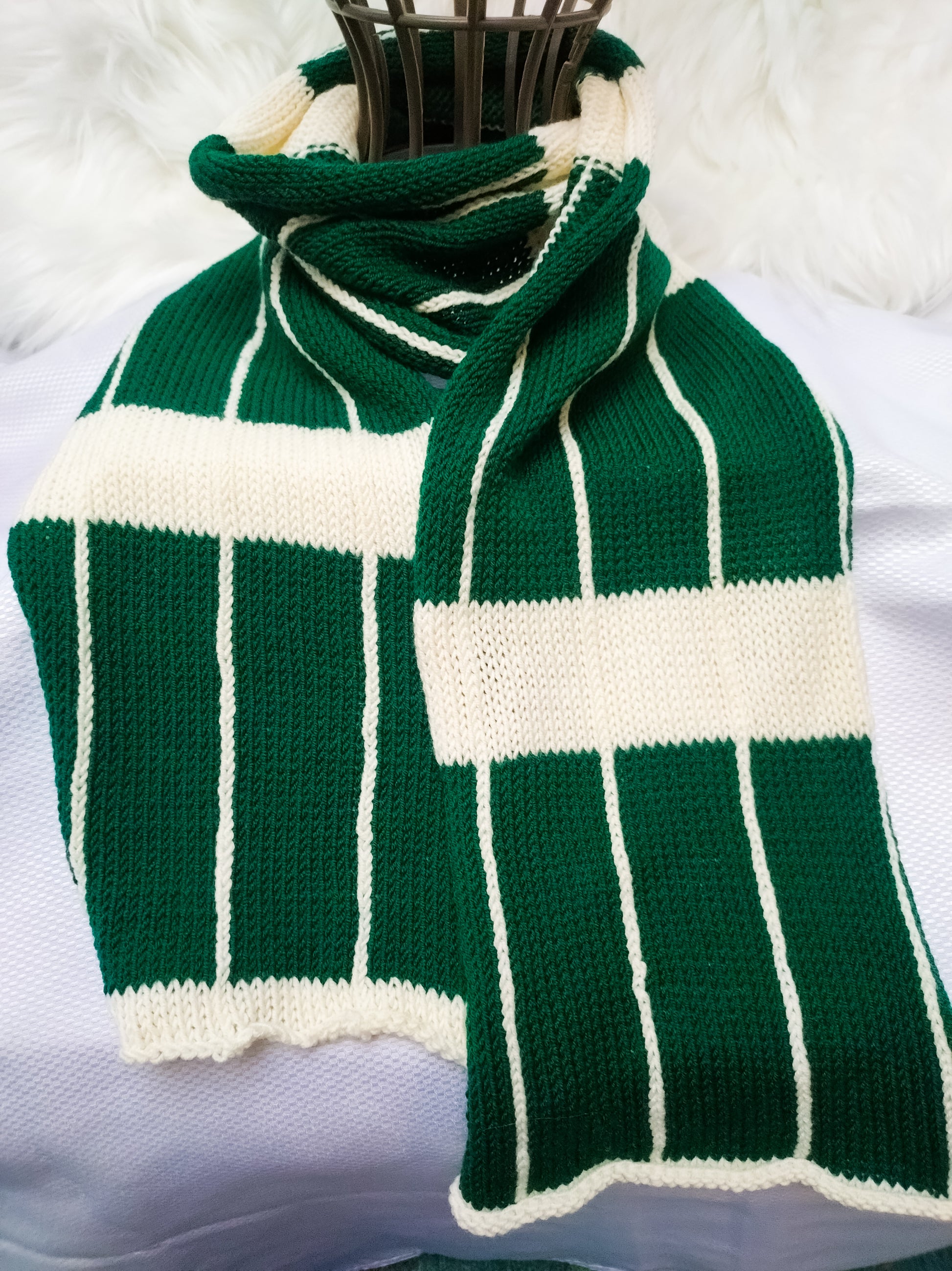 Flatlay photo of a Large Checkered Merino wool  soft sustainable scarf in colours bottle green & cream
