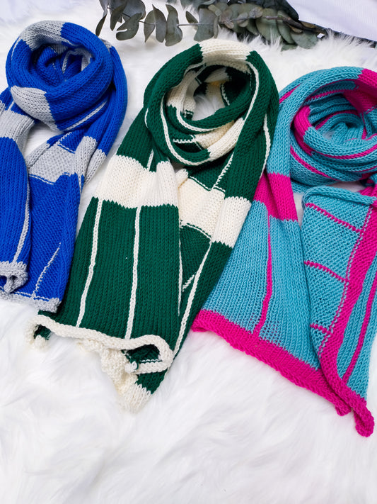 Flatlay photo of 3 handmade sustainable Large Checkered Merino wool scarves. colours include: bottle green & cream, cobalt blue & silver grey, turquoise & magenta pink
