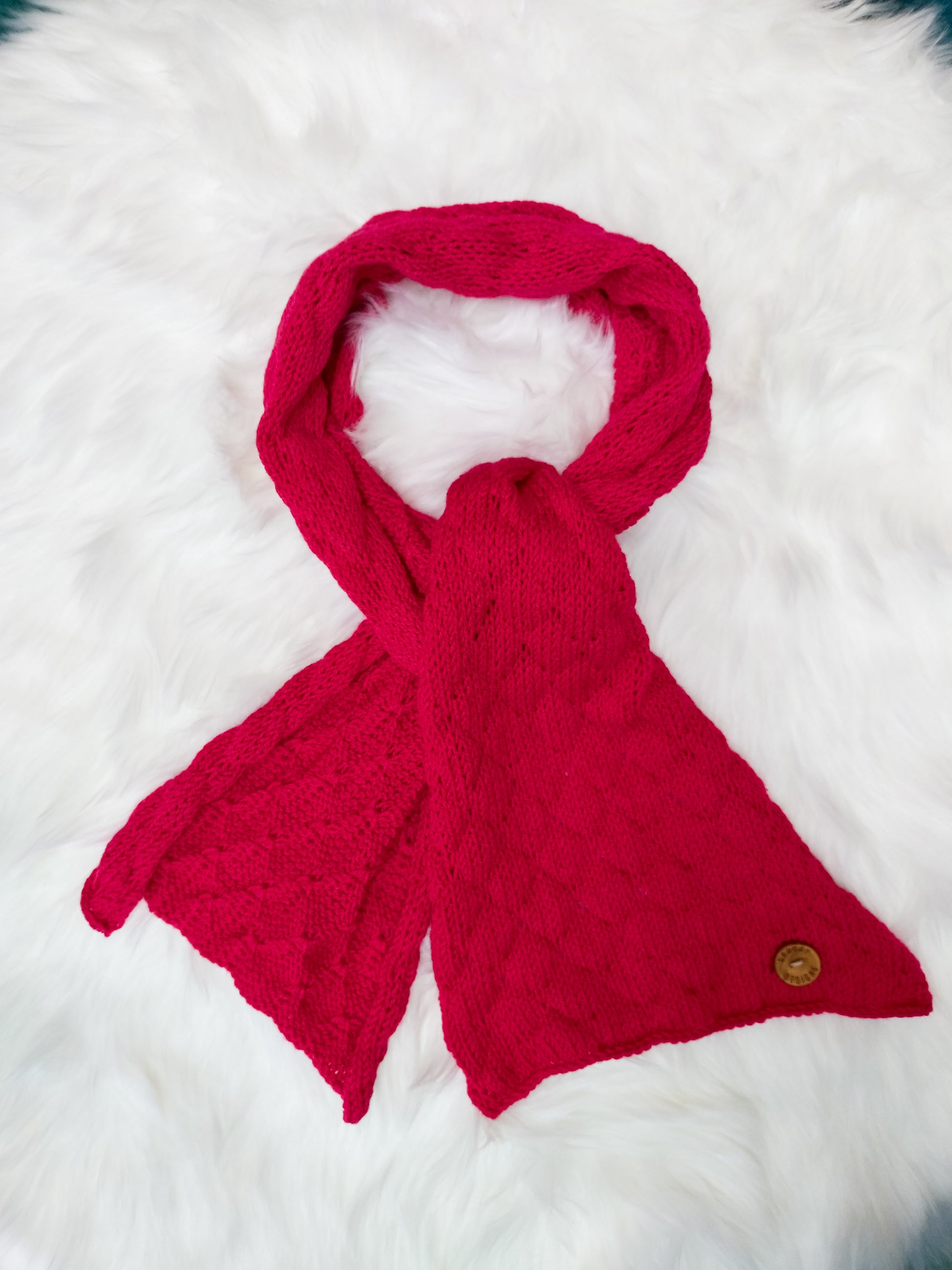 Bright cherry red soft merino scarf handmade using sustainable materials, by UK knitwear brand Spuggy Designs.
Christmas gifts. Classic red scarf. Gifts for her, gifts for teens, gifts for mum, gifts for girlfriends. Dopamine dressing UK. Gifts for him UK.