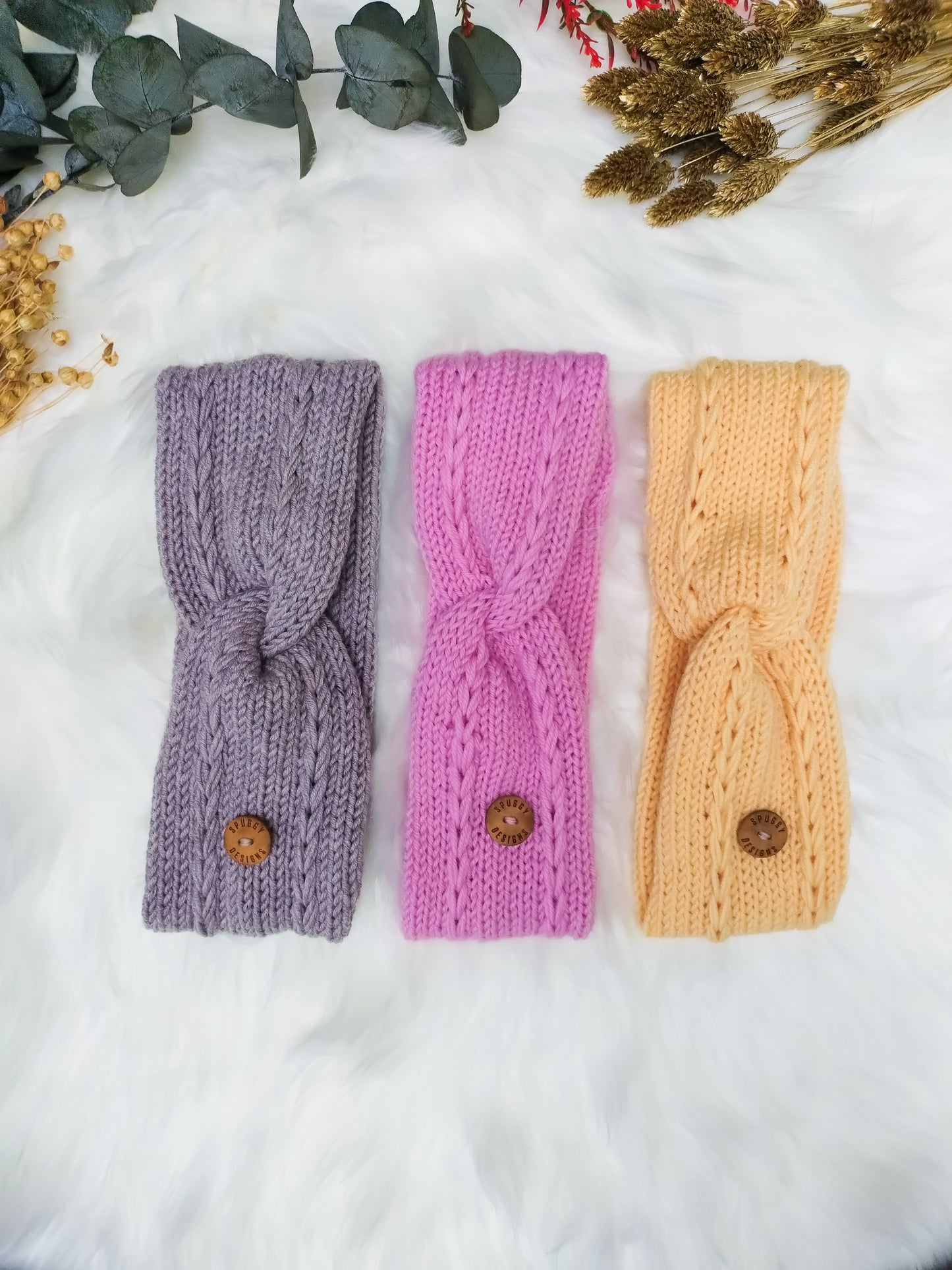A collection of soft merino headbands, with a braided cable design. Handmade in the UK by sustainable knitwear brand Spuggy Designs. Perfect gift for teens, girlfriends, friends, sisters. Christmas gifts UK. Bubblegum pink, buttercup yellow, and fawn.