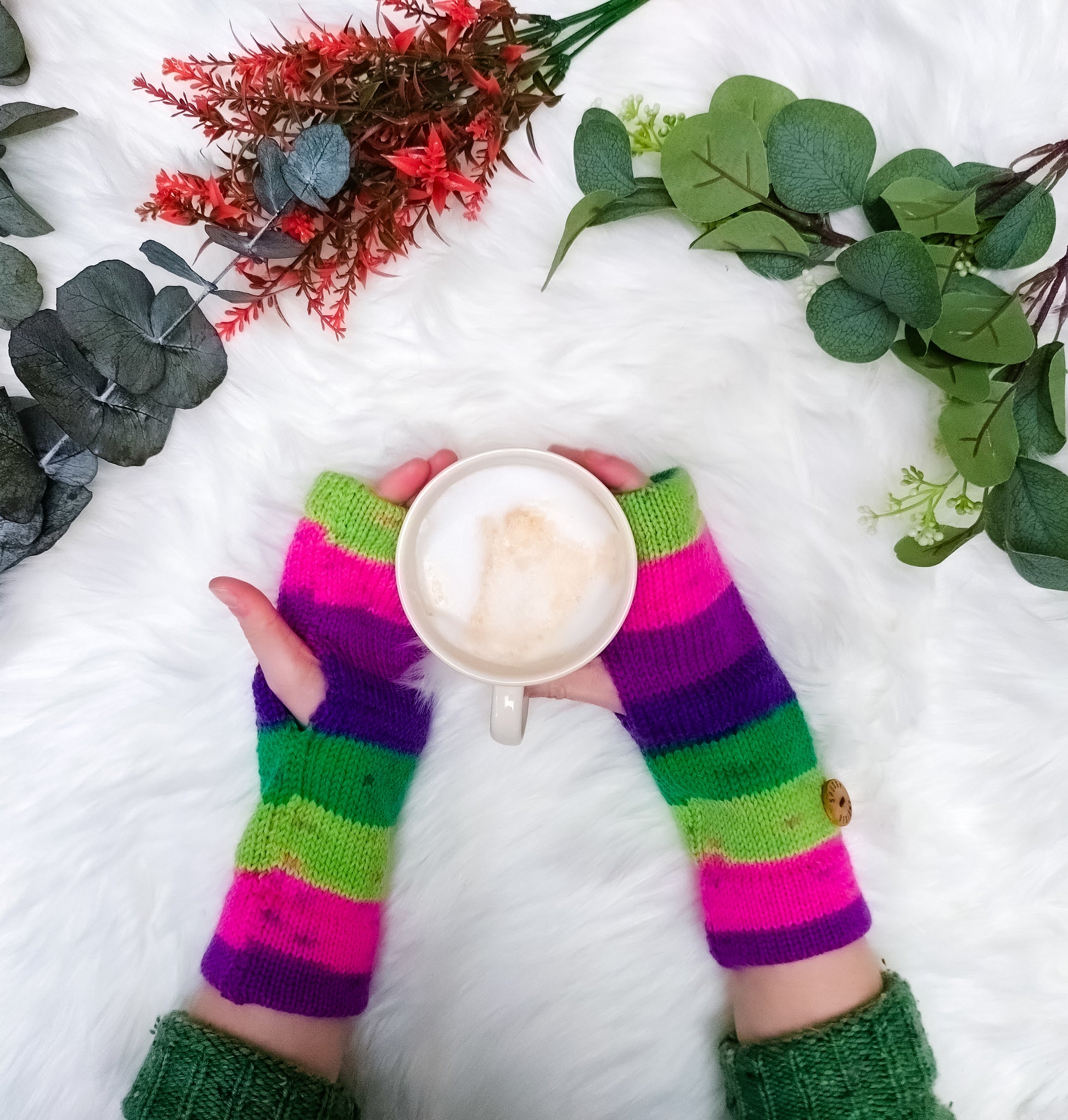 A pair of colourful striped ready-to-ship knitted wool wrist warmers, from sustainable knitwear brand Spuggy Designs.
Colours are perfect for dopamine dressing, and for the spooky autumn season.