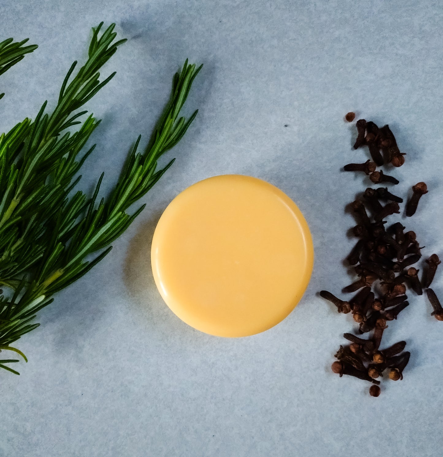 Lanolin enriched soap, photographed surrounded by fresh herbs and dried cloves.
Spuggy Designs Lanolin soap bars have fresh, natural scents - created using natural essential oils.