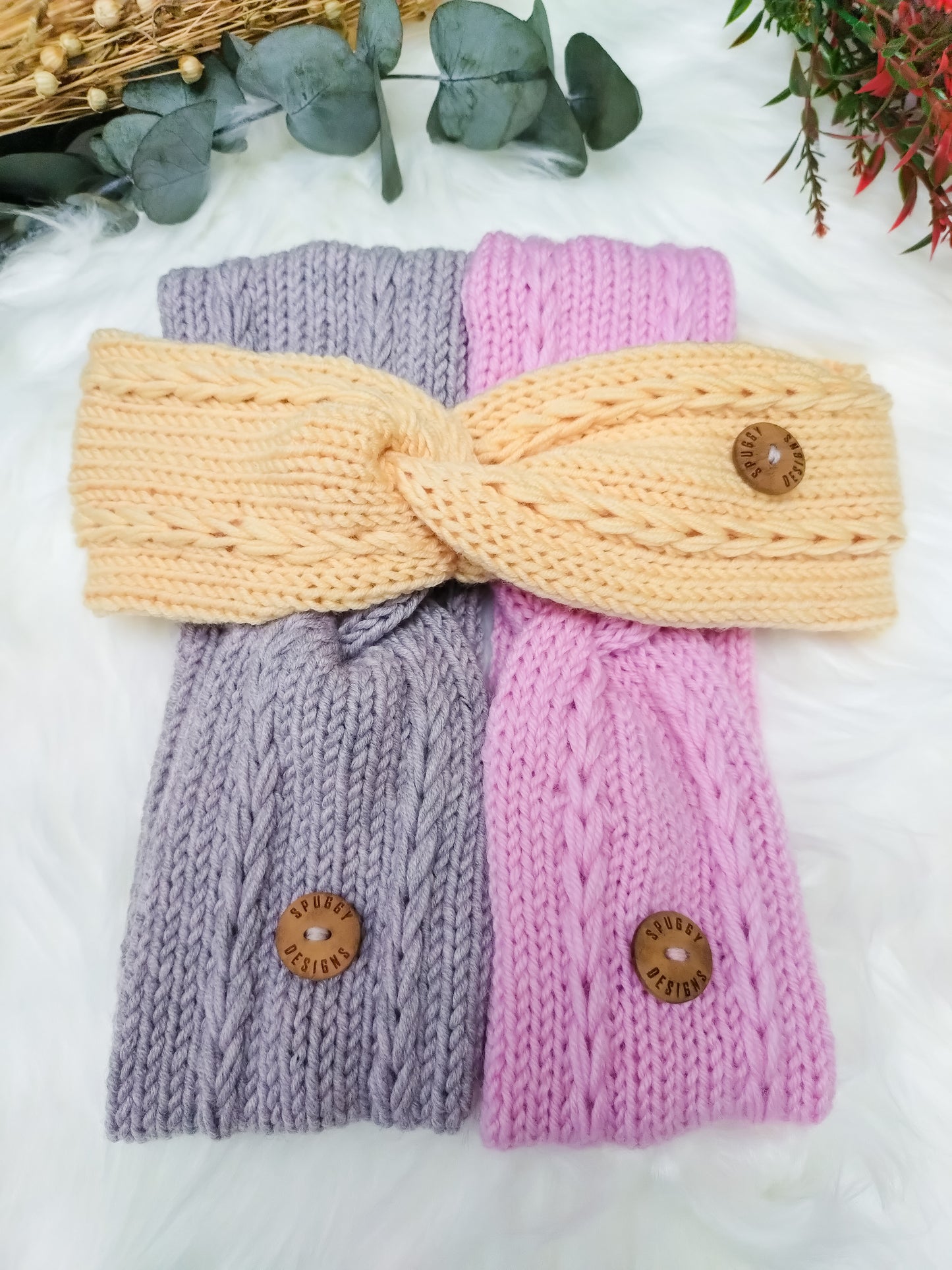 A collection of soft merino headbands, with a braided cable design. Handmade in the UK by sustainable knitwear brand Spuggy Designs. Perfect gift for teens, girlfriends, friends, sisters. Christmas gifts UK
