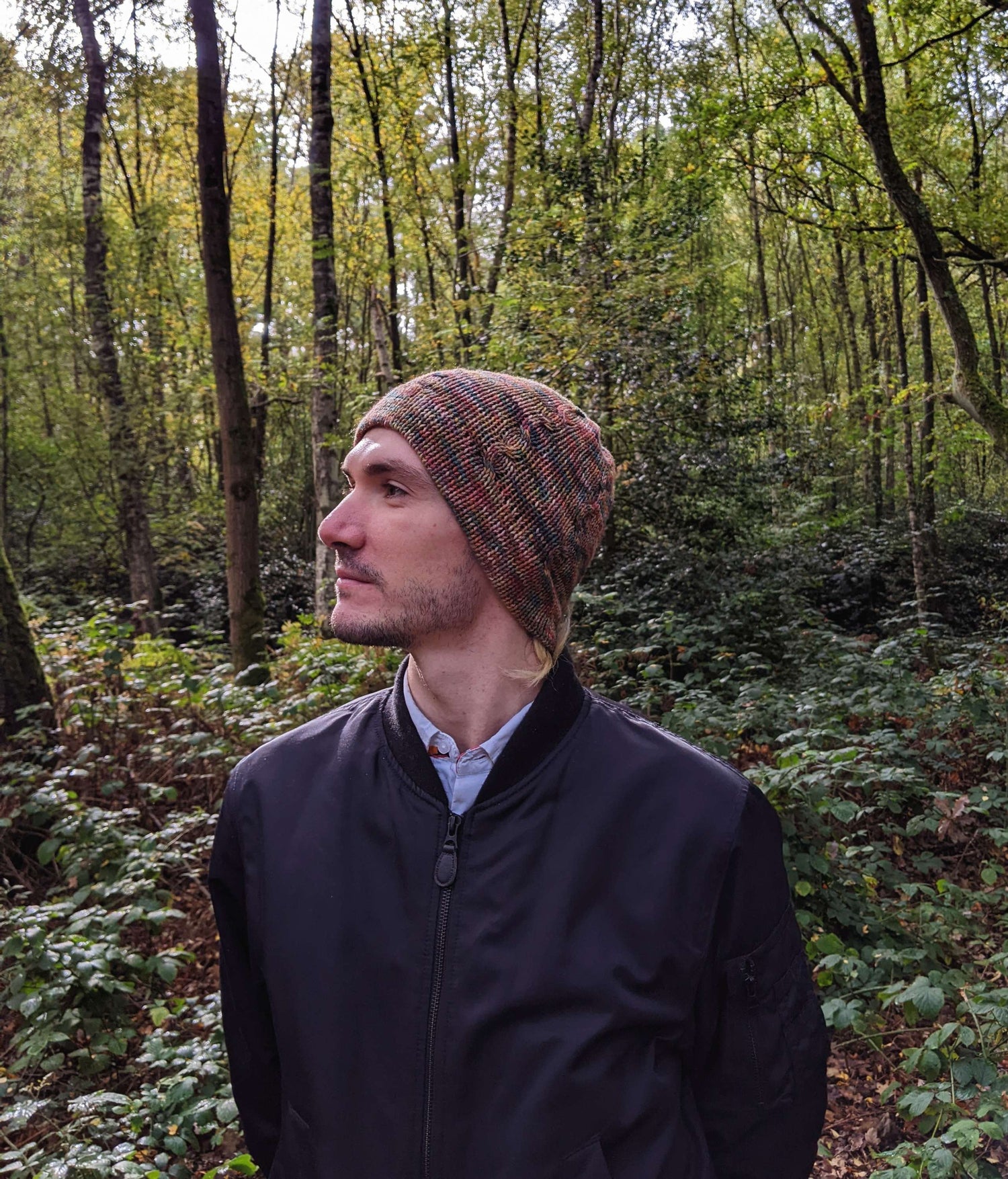 British wool beanie hat, on male model with woodland background