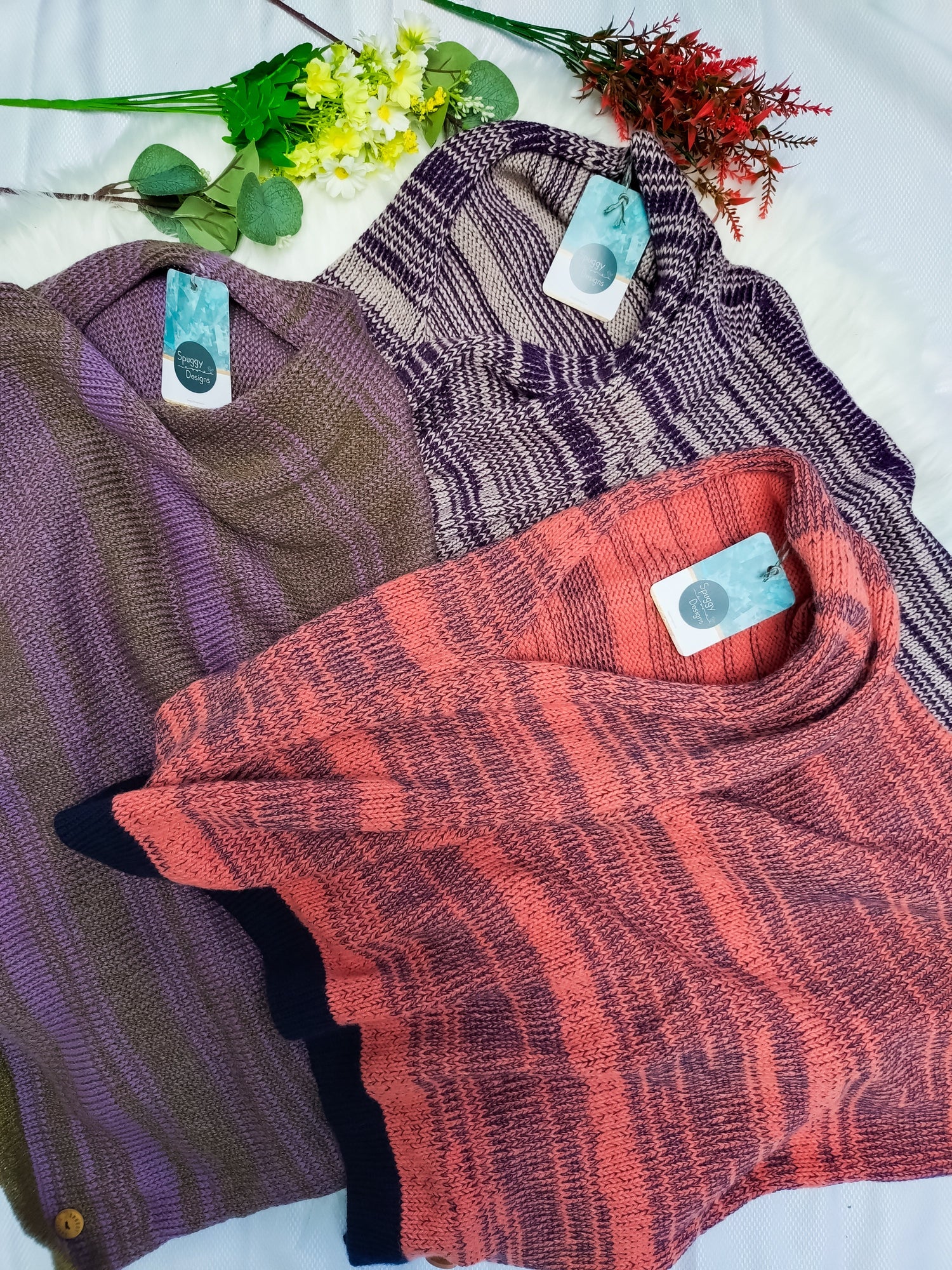 Colourful sustainable knitwear. Handmade using British wool and Merino wool. Unique style poncho. Broken stripe pattern. 