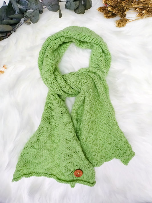 Pale apple green soft merino scarf  handmade using sustainable materials, by UK knitwear brand Spuggy Designs.
Christmas gifts. Classic red scarf. Gifts for her, gifts for teens, gifts for mum, gifts for girlfriends. Dopamine dressing UK.
