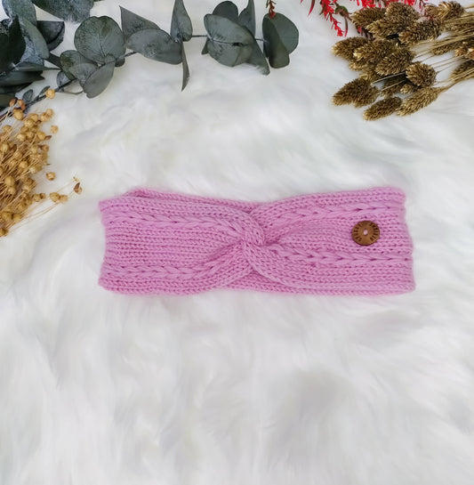 Bubblegum pink soft merino headband, with a braided cable design. Handmade in the UK by sustainable knitwear brand Spuggy Designs. Perfect gift for teens, girlfriends, friends, sisters. Christmas gifts UK. Dopamine dressing.